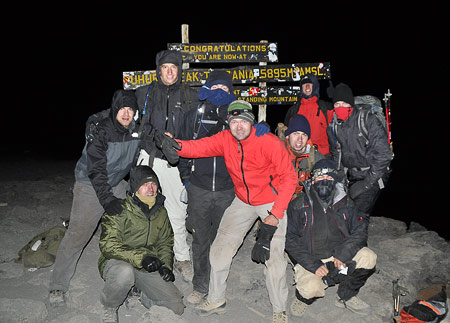 Tom Stuivenberg and group on the summit of Kilimanjaro, 7summits.com Expeditions