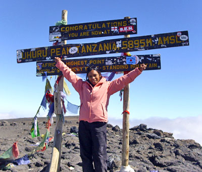 Yani fernandus at Kilimanjaros summit with 7summits.com expeditions