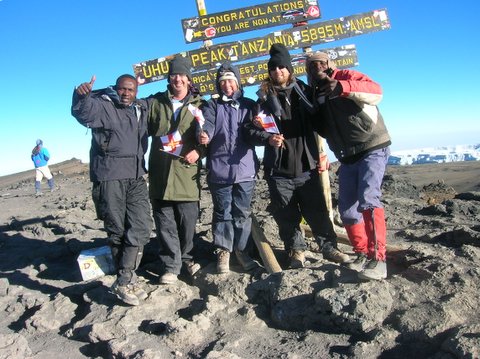 Alan Kelsey Guerin on the summit of Kilimanjaro, 7summits.com Expeditions